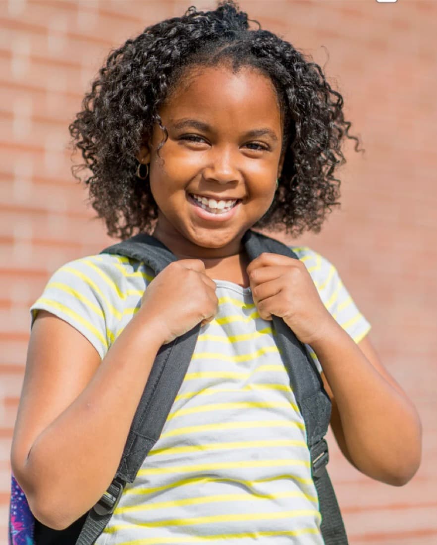 Child with backpack representing hope and support